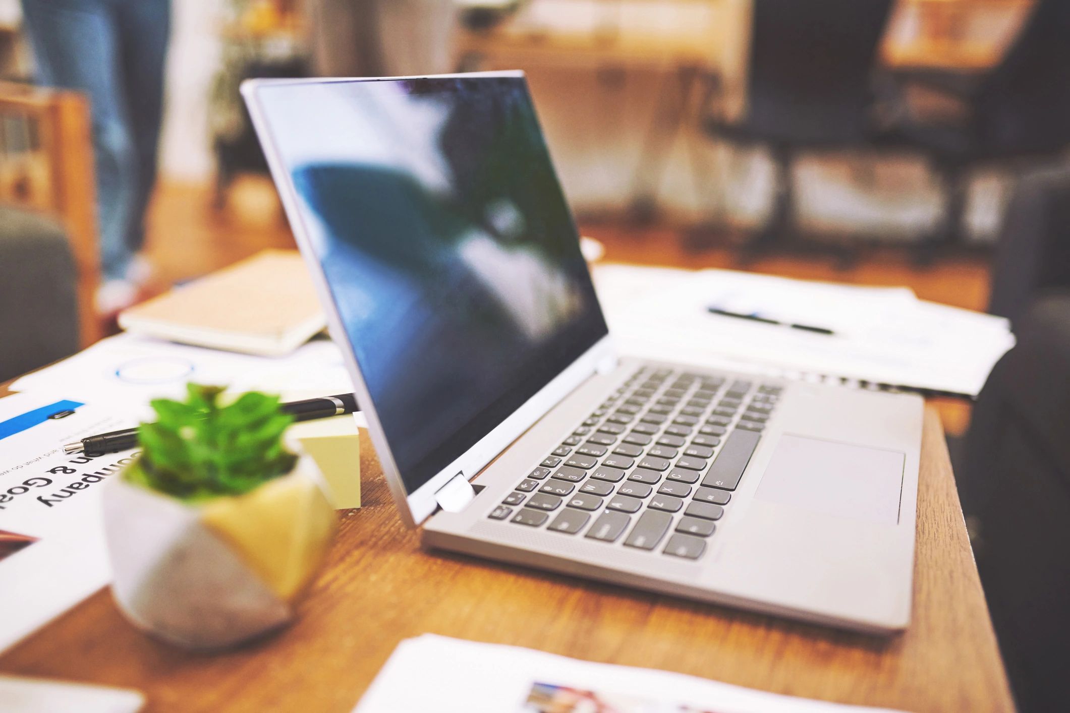 Laptop on a desk representing email support