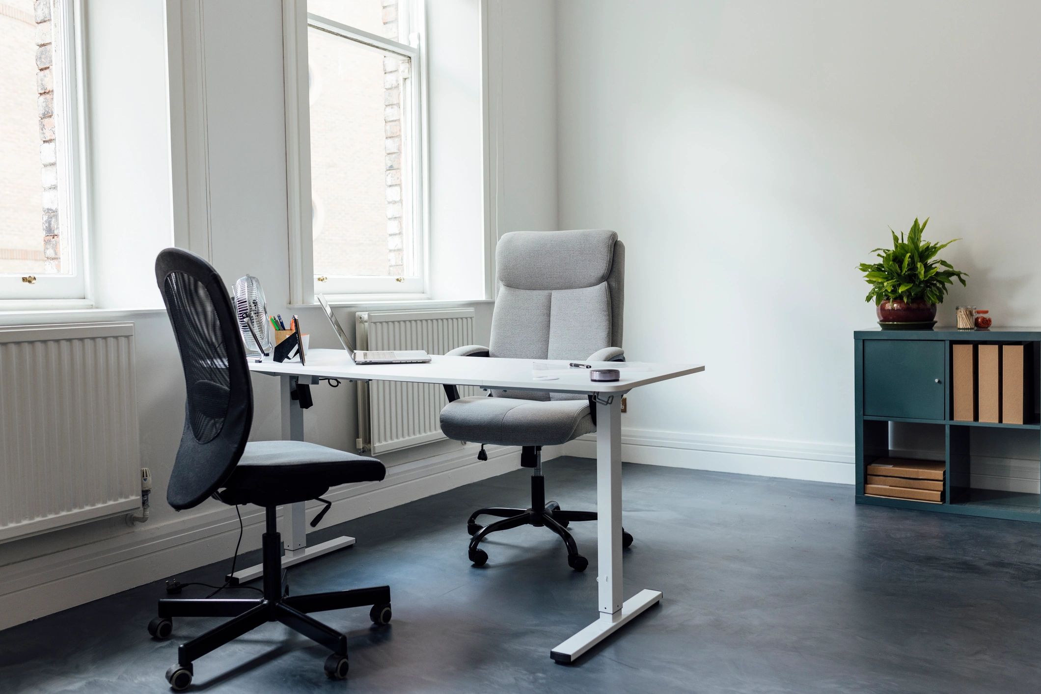 Home office desk setup with laptop and workspace essentials